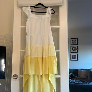White and yellow tiered ruffle high low dress.